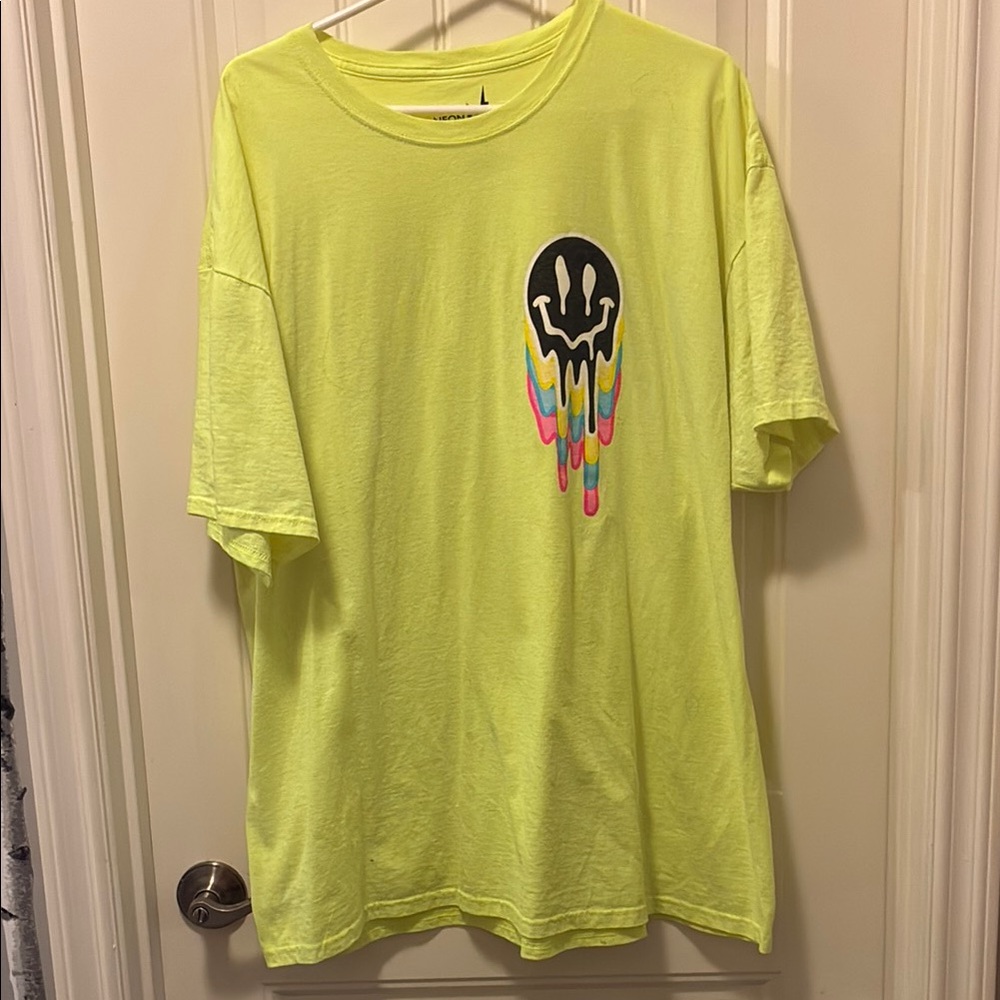 Vibrant Yellow Tee with Dripping Smiley Design